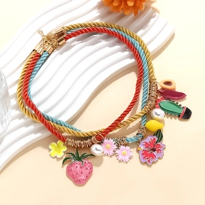 Multi-strand strawberry cactus and daisy charm necklace with colorful woven ropes