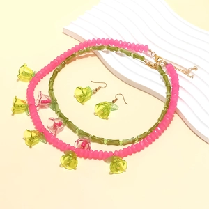 Handmade beaded flower pendant necklace and earrings set with pink and green resin beads