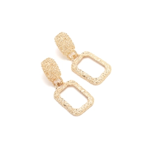 Retro golden geometric rectangle earrings with textured hammered finish on white background
