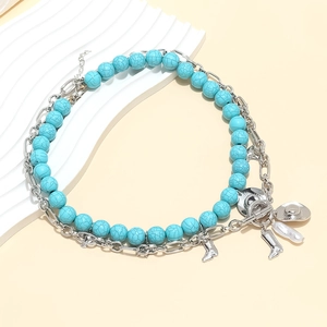 Bohemian multilayer necklace with turquoise beads and western cowboy charms including boots