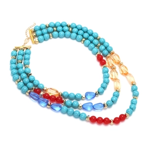 Three-layer bohemian beaded necklace with turquoise-style stones and red accents