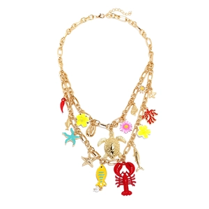 Multilayer gold necklace featuring lobster, turtle, and tropical fish ocean charms