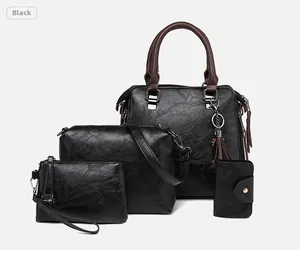 Dettaglio del set di 4 borse da donna nere in ecopelle con borsa a mano e tracolla