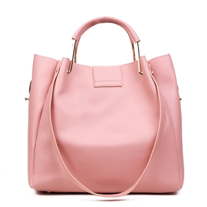 Pink faux leather tote bag with unique gold metal handles and tassel accent charm