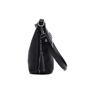 Black pebbled leather bucket bag with tassel zipper and gunmetal chain details
