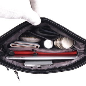 Large capacity black leather bucket bag with multiple functional interior compartments