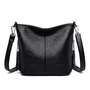Classic black litchi leather bucket bag with fringe details and adjustable strap