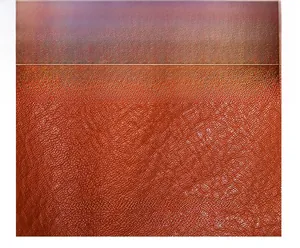 Close-up detail of premium brown backpack featuring high-quality litchi grain leather texture