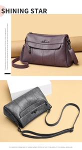 Detail of lychee pattern leather shoulder bag with metallic logo and zipper closure