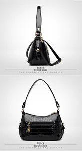 Détails d'un sac à main noir en similicuir avec motif crocodile et accents dorés