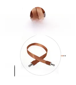 Brown nylon shoulder strap with leather ends and swivel metal hooks for designer bags