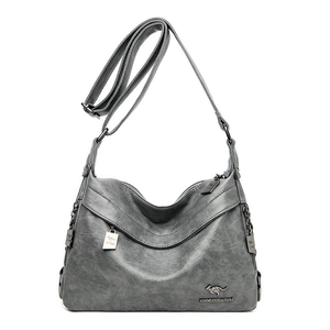 Elegant grey leather crossbody bag for women with kangaroo logo and metallic pendant charms
