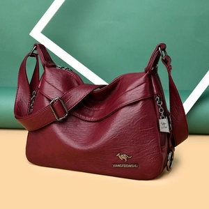 Burgundy faux leather shoulder bag with adjustable strap and silver kangaroo hardware