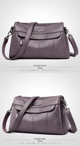Detail of purple textured leather handbag with silver logo and adjustable strap
