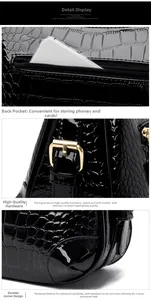 Détails du sac en cuir verni noir avec boucles dorées et poche arrière zippée pratique