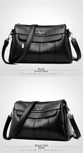 Detail of black crossbody bag with lychee texture, gold kangaroo logo and vertical stitching