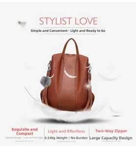 Brown lychee texture backpack with silver hardware, dual zippers, and gray fur ball charm