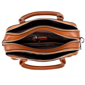 Brown crocodile pattern shoulder bag with triple zipper compartments and dual handles