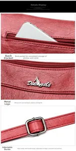 Detail of red pebbled leather shoulder bag showing zipper pocket and metal buckle