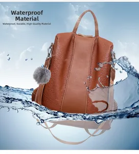 Close-up of waterproof textured brown leather backpack showing water splashing on surface