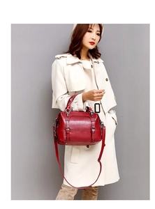 Red oil wax leather Boston handbag with litchi texture and adjustable shoulder strap