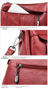 Detail of dark red lychee leather texture with metal zipper and front pocket hardware