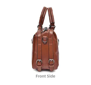 Detailed side view of brown crocodile texture Boston bag with metal buckles and D-ring