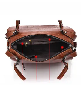 Interior structure of the brown crocodile pattern Boston bag showing multiple compartments