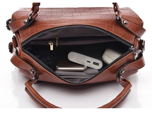 Top view of crocodile pattern Boston bag showing spacious interior and silver zipper