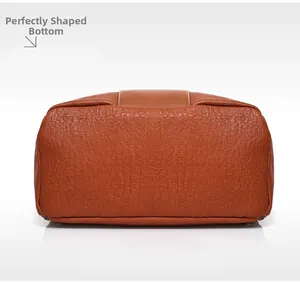 Detail shot of the bag bottom showing premium lychee texture leather and neat stitching