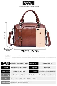 Size comparison of a brown faux leather satchel bag next to an iPhone for scale