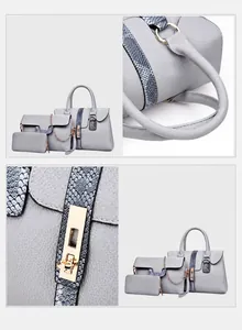 Detailansicht des grauen Handtaschen-Sets aus Leder mit blauem Schlangenmuster und Goldbeschlag