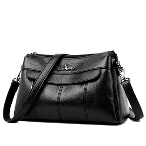 Classic black leather crossbody bag for women with silver hardware and textured finish