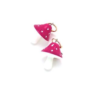 Close-up of vibrant pink mushroom charm with white dots and gold metal ring attachment