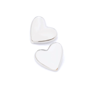 Polished silver heart-shaped stud earrings in a minimalist metallic finish for women