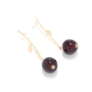 Fashionable cherry drop earrings with deep red resin fruit and golden metal leaf stems