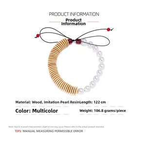 Detail showing 122cm beaded necklace with wood disks, pearls and red glaze beads