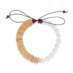 Handmade beaded choker with beige wooden discs and white faux pearls on white background