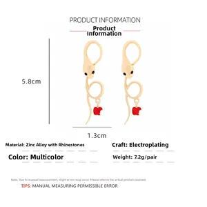 Detailed dimensions of snake and red apple earrings with rhinestones and gold plating