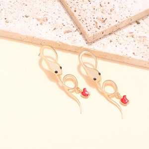 Creative matte gold snake earrings with vibrant red apple pendants and rhinestones