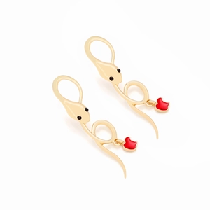 Detail of gold snake earrings with red apple pendants and bitten design accents