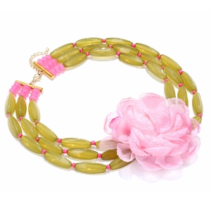 Exaggerated summer beaded necklace with green beads and a large pink fabric flower