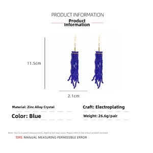 Detail view of long blue crystal tassel earrings with dimensions 11.5cm by 2.1cm