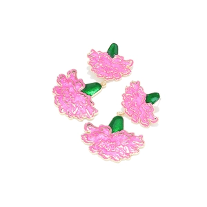 Pink enamel carnation flower earrings with green leaves and gold-plated metal outline