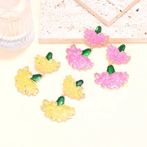 Detailed view of pink and yellow enamel carnation stud earrings with gold metallic edges
