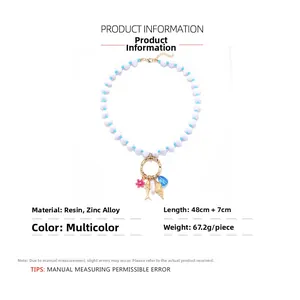 Détails du collier de perles océaniques avec pendentifs de poisson et de coquillage