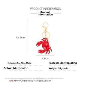 Detail view of red crab keychain with dimensions 12.2cm in zinc alloy and gold plating