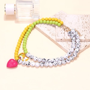 Bohemian multi-layer beaded necklace with pink heart and yellow floral enamel pendants