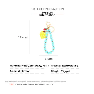 Beaded keychain with heart, lemon, strawberry charms and dimensions 19.6cm by 3.5cm