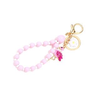 Porte-clés flamant rose fait main avec perles roses et pendentif marguerite dorée